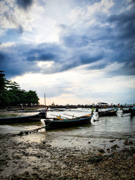 istock Coastline with boats an dramatic sky 1412676310