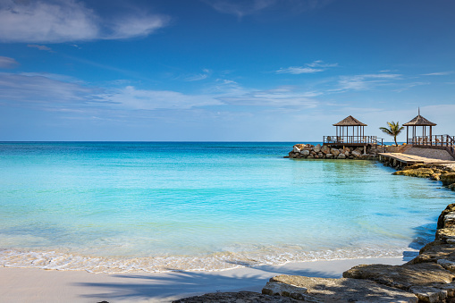 Tropical paradise: idyllic caribbean beach with pier and gazebo, Montego Bay, Jamaica