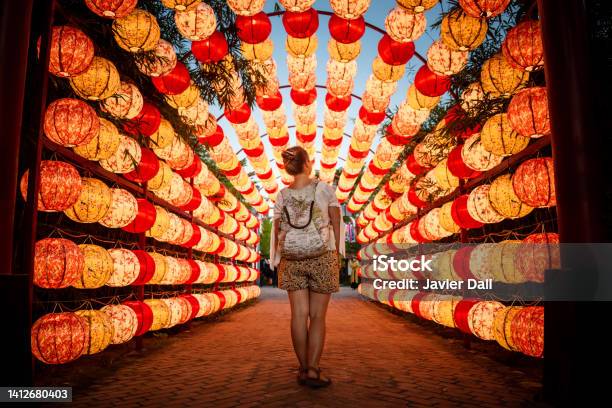 Tourist Walking Through Beautiful Arch Of Lights In Hoi An Vietnam Stock Photo - Download Image Now