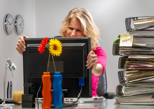 istock Young woman in office working late 1412680965