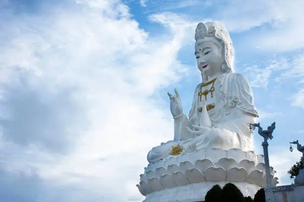 White Quan Yin or Kuan Yin chinese goddess statue for thai people traveler travel visit and respect praying blessing deity mystical at Wat Huay Pla Kang temple at Chiangrai city in Chiang Rai Thailand