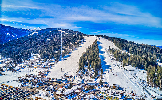 ski lifts on mountains with ski slopes shot in austria