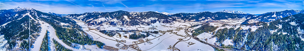 ski lifts on mountains with ski slopes shot in austria.