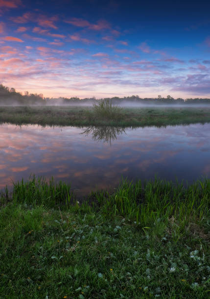 istock Beautiful spring sunrise over river banks 1412686999