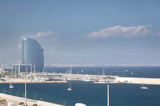 10th June, 2022 - View of the Marriott boutique hotel vela (sail hotel), across the port of Barcelona in Spain