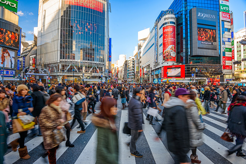 Tokyo, Japan - December 24, 2012: Pedestrians cross Shibuya Crossing, one of the busiest crosswalks in the world.