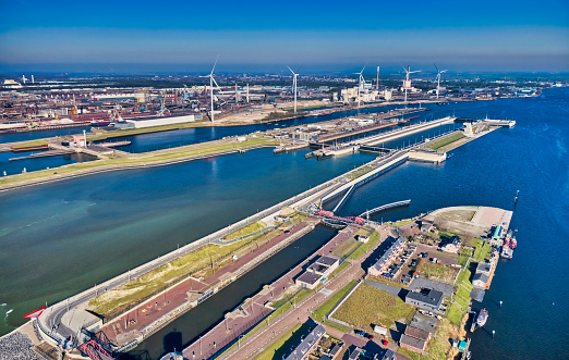 Netherlands, IJmuiden - 20-02-2022: Aerial view of the largest sluice (lock) in the world. For the largest boats and ships a new sea lock in the Noordzeekanaal.