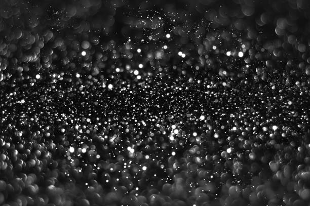 istock Gray black sparkling glitter bokeh background 1412690401
