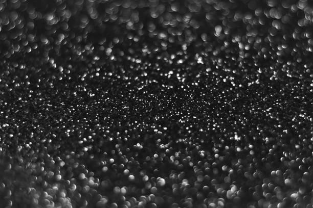 istock Gray black sparkling glitter bokeh background 1412690829