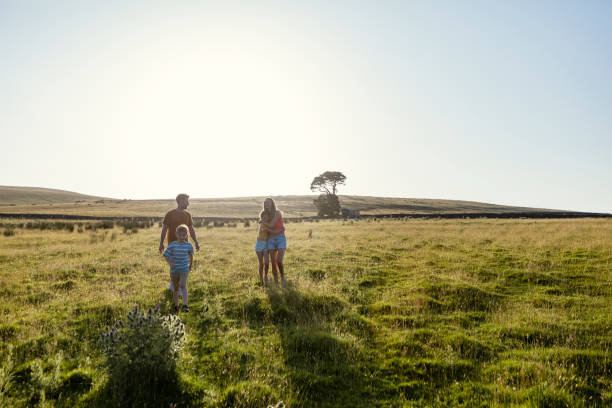 istock Family Walking on Sunny Evening 1412691367