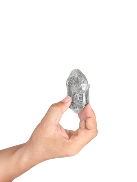 istock Hand holding natural diamond isolated on white background 1412696373