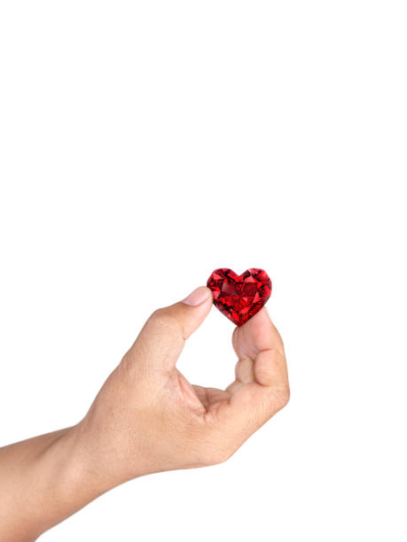 istock Hand holding red heart shaped diamond isolated on white background 1412696390