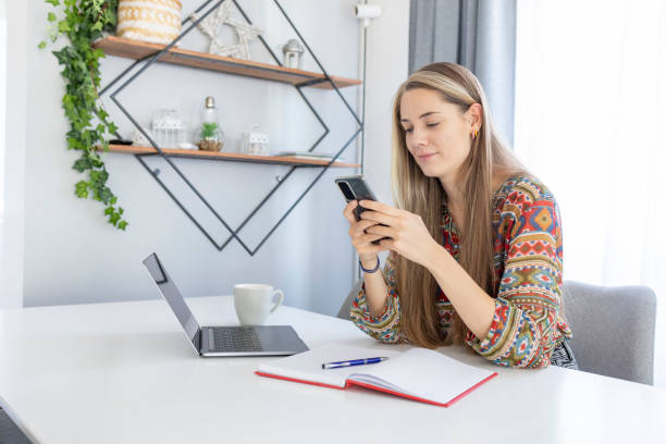 istock Young woman studying at home 1412696445