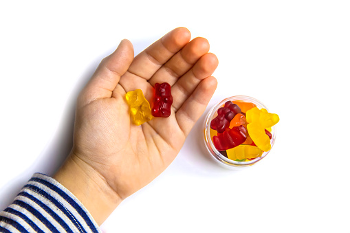 Jelly vitamins candy teddy bears isolate on a white background. Selective focus. Child.