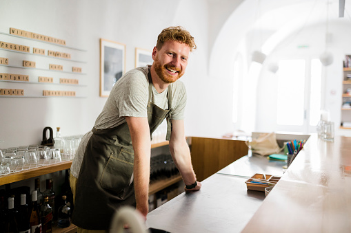 Portrait of Smiling Waiter in a Coffee Shop