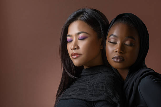 istock Two Beautiful Muslim Women in a studio shot 1412697894