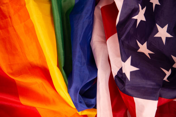 istock Equality. American and gay flag side by side. 1412698165