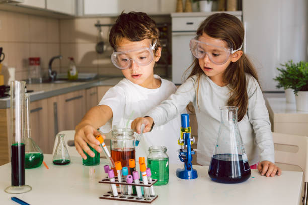 istock Children playing expreiments at home 1412698213