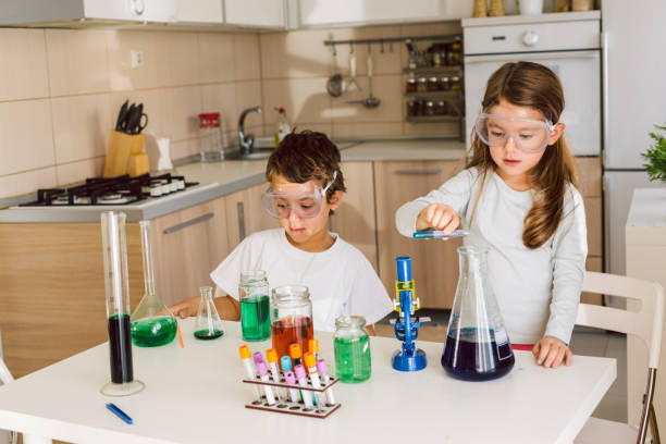 istock Children playing expreiments at home 1412698249