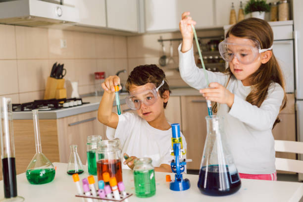 istock Children playing expreiments at home 1412698270