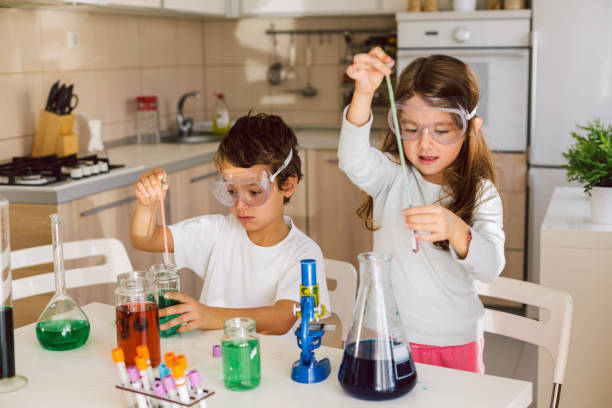 istock Children playing expreiments at home 1412698369