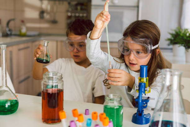 istock Children playing expreiments at home 1412698454