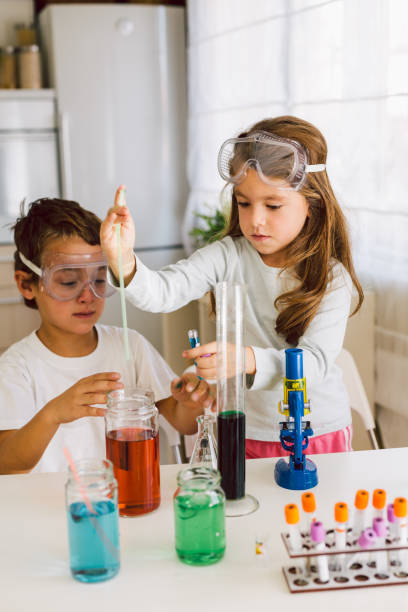 istock Children playing expreiments at home 1412698577