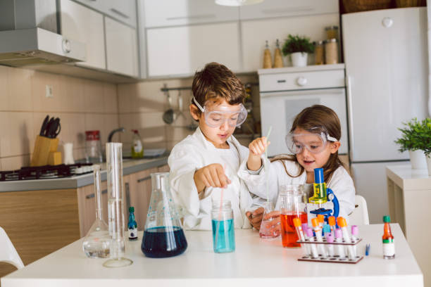 istock Children playing expreiments at home 1412699268