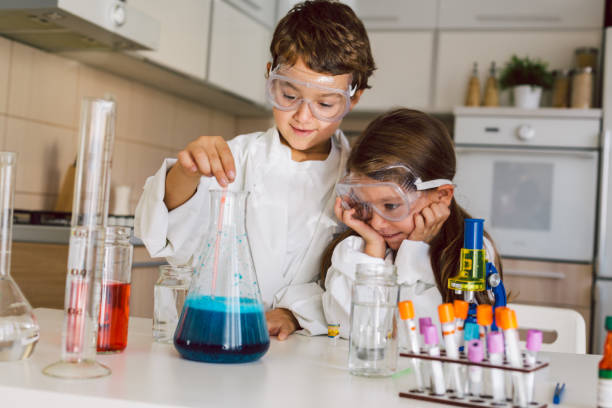 istock Children playing expreiments at home 1412699404