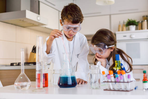 istock Children playing expreiments at home 1412699447
