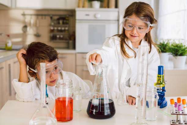 istock Children playing expreiments at home 1412699541