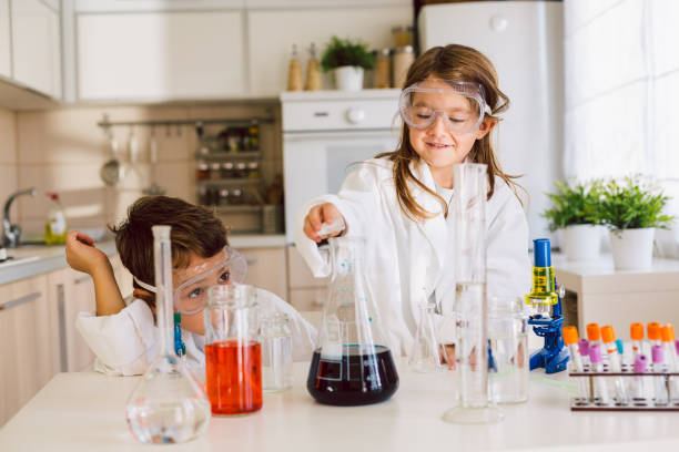 istock Children playing expreiments at home 1412699576
