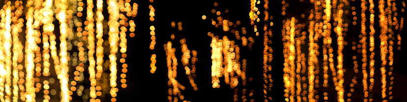 Defocused outdoor decoration of celebration lights at night