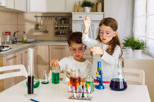 istock Children playing expreiments at home 1412700478