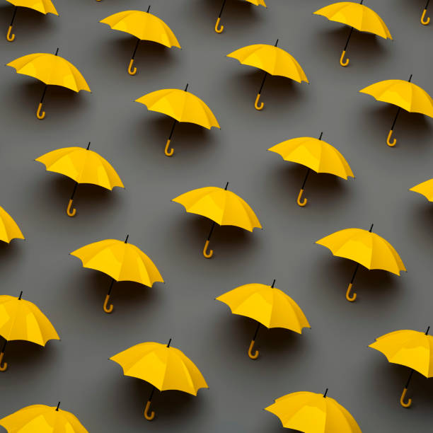 istock Pattern of yellow umbrellas on gray background. Autumn symbol. Fall colors. 3D rendering. 1412700669