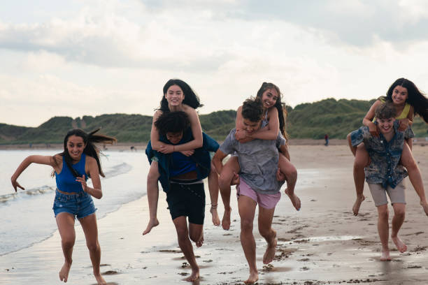 istock Piggy Back Race on the Beach 1412701365