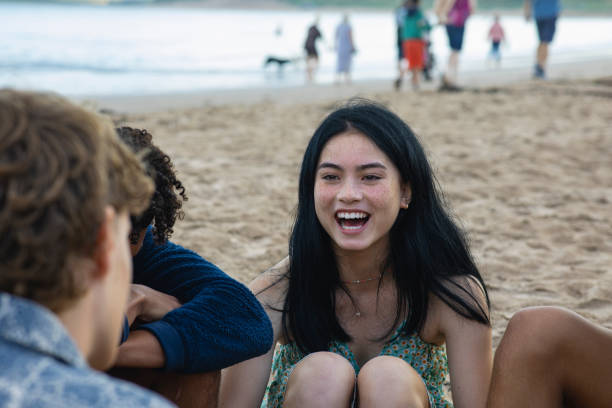 istock Relaxing with Friends at the Beach 1412701366
