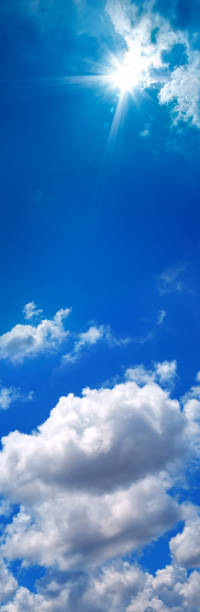 istock Beautiful sunny and shiny cloudscape of sky only vertical panoramic background 1412701452