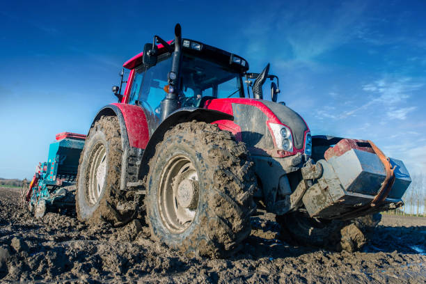 istock Tractor equipped with a trailer for close-up planting 1412701492