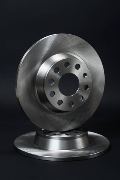 istock New brake discs on a black background. 1412704239