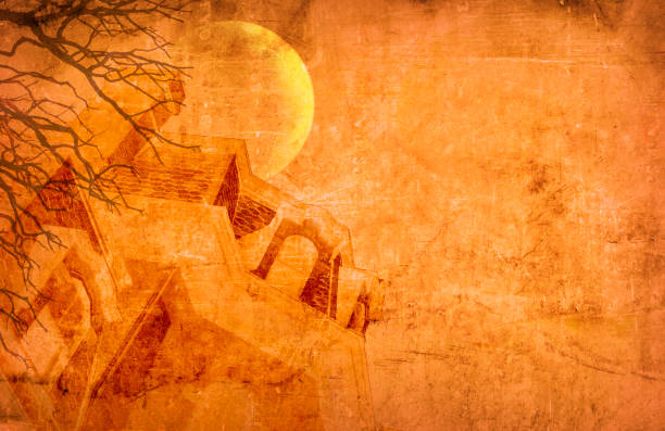 A haunted house and moon framed by the branches of a bare tree against an orange grungy background.