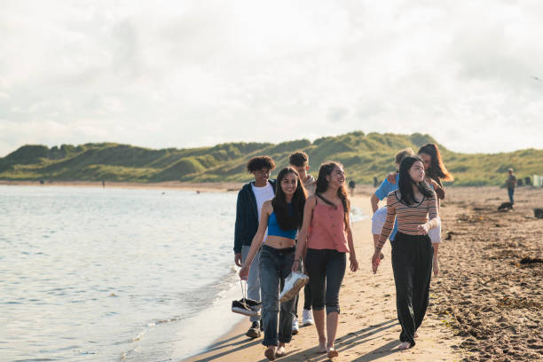 istock Walking along the Beach Together 1412704675
