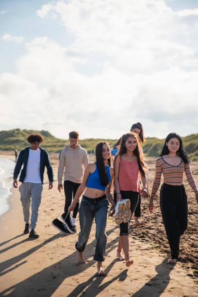 istock Walking along the Beach Together 1412706238