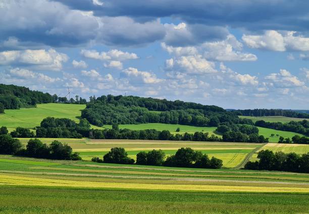 istock Colorful landscape with fields in the Eifel mountains, Germany 1412708484