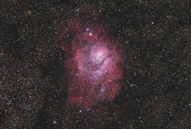 The Lagoon Nebula , Messier 8 or NGC 6523, is a giant interstellar cloud in the constellation Sagittarius