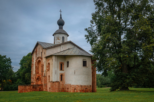 View of the Church of St. Paraskevi (Paraskevy Pyatnitsy na Torgu) on the territory of Yaroslavovo Dvorishche on a cloudy summer day, Veliky Novgorod, Russia