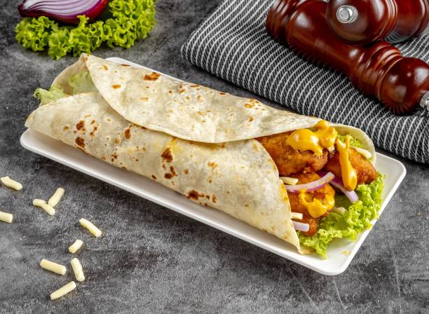 istock Cheesy Chicken shawarma Wrap served in a cutting board on grey background side view of fastfood 1412717547
