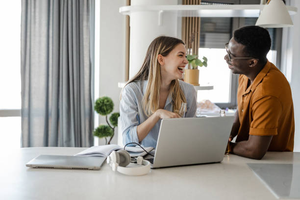 istock Boyfriend and girlfriend working together from home 1412718274