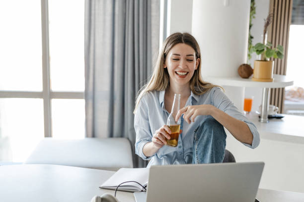 istock Relaxing after work and drinking beer at home 1412718415