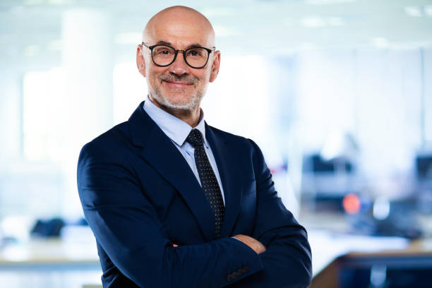 istock Successful businessman wearing suit and tie while standing at the office 1412718498